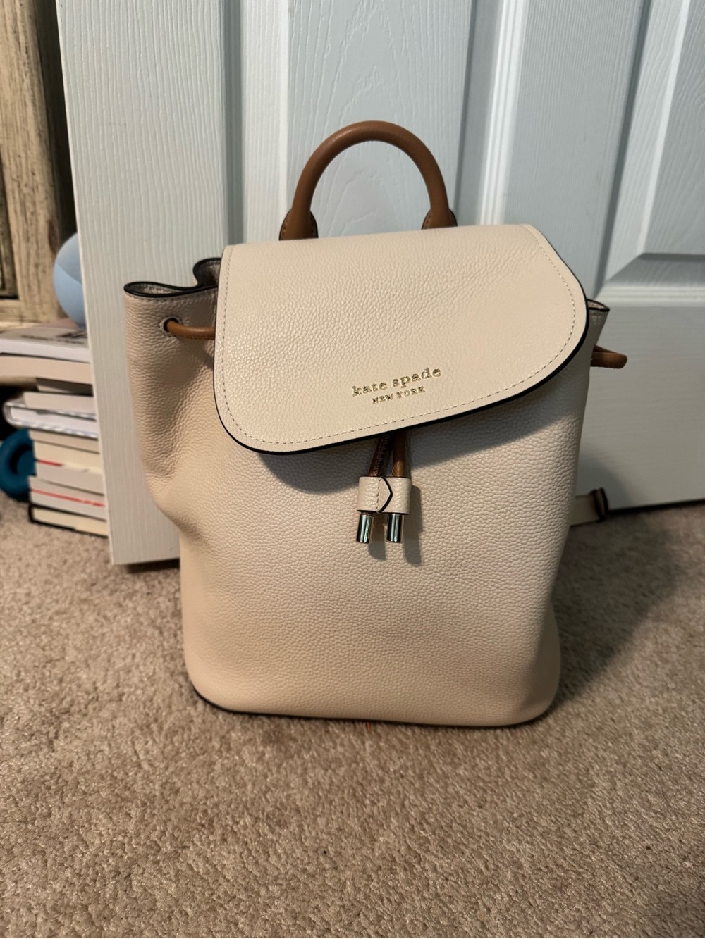 kate spade cream leather drawstring mini backpack with tan accents